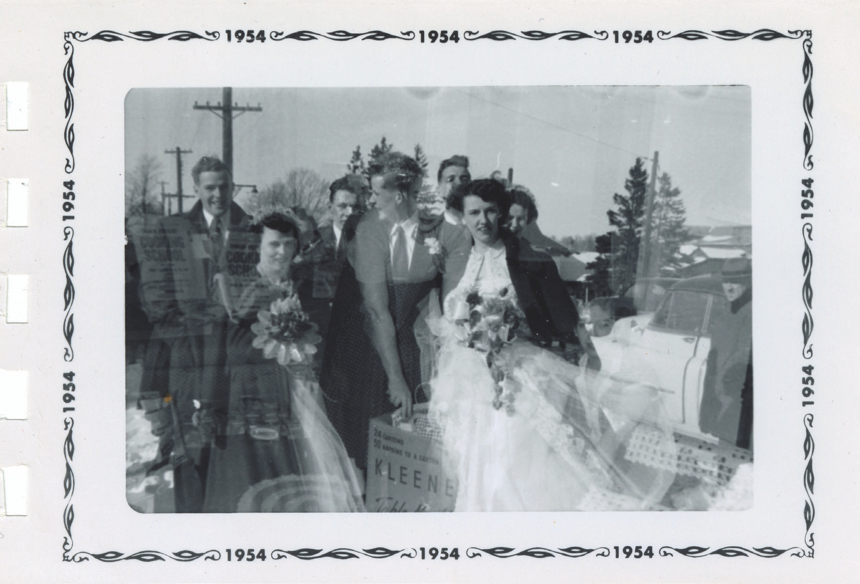 1 
Accidental double exposure of a wedding party and two women posing with cardboard boxes, photographer unknown, 1954. Author’s personal collection