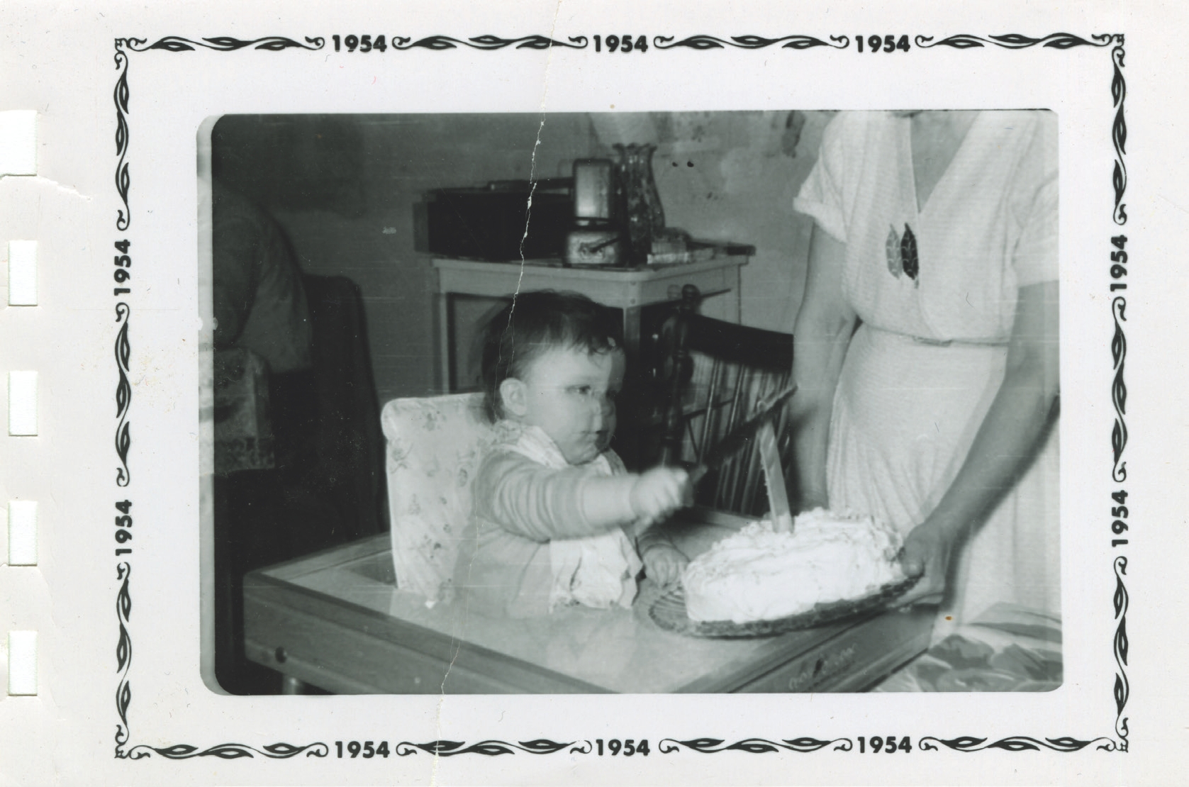 6 
A blurry, candid image of a baby with a birthday cake, photographer unknown, 1954. Author’s personal collection