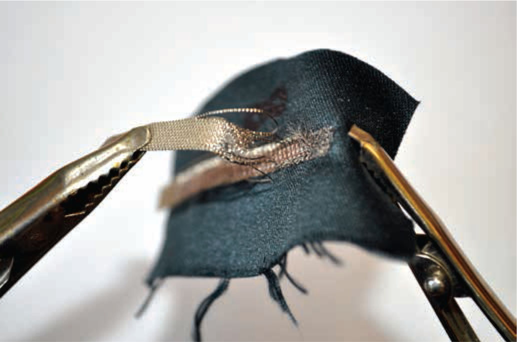 Figure 8 Broken fibres of the electroconductive path after bonding strength test.