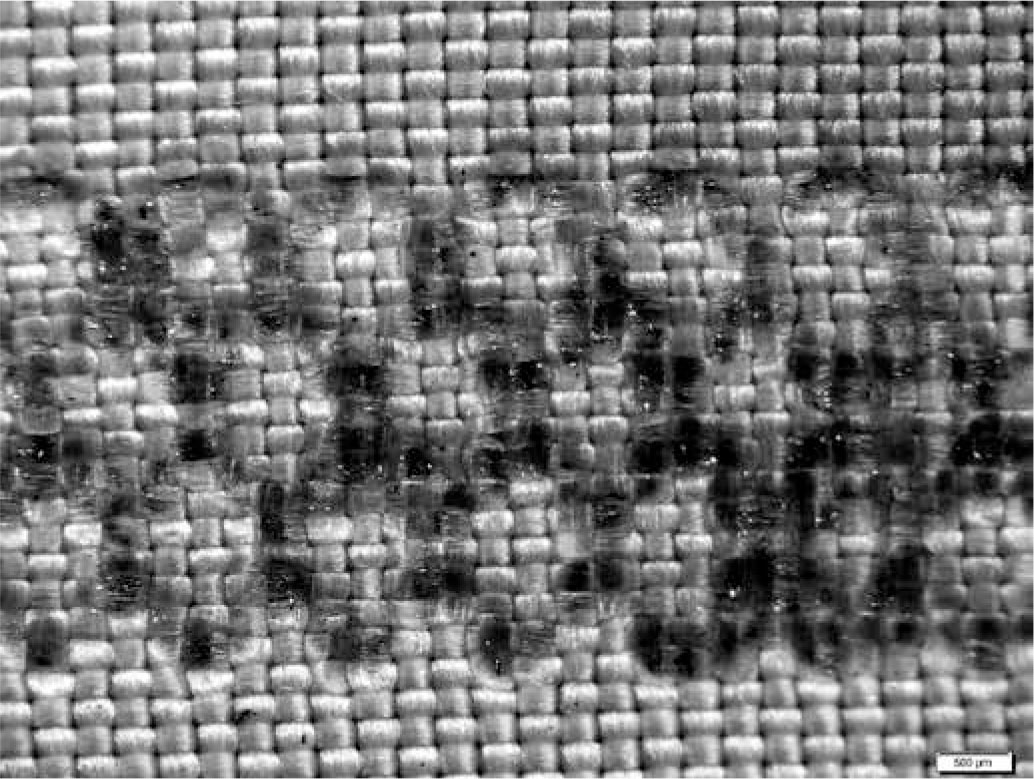 Figure 9 Damages of the textile substrate caused by ultrasonic welding (power - 60%, speed - 0,5m/min, pressure - 4,0 Bar).